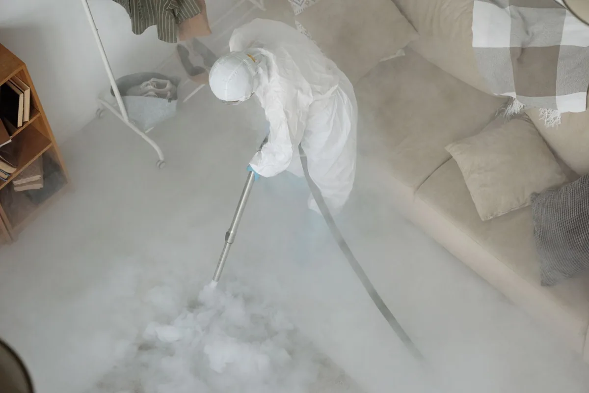 Biohazard cleanup technician in protective equipment, Applewood, CO